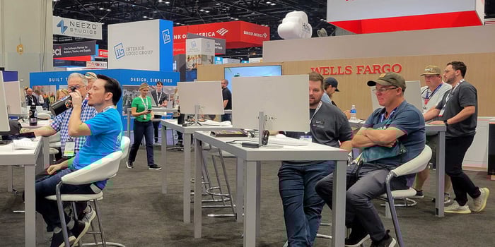 Product Specialists and IBS attendees at ConstructionOnline's bustling booth at the 2026 International Builders' Show in Orlando, Florida